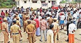 Police personnel and the relatives of four deceased girls assemble outside the postmortem block of Adukamparai GH in Vellore on Saturday | Express