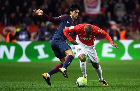 Paris Saint-Germain's Argentinian midfielder Javier Pastore (L) vies for the ball with Monaco's French defender Djibril Sidibe during the French L1 football match between Monaco (ASM) and Paris Saint-Germain (PSG) at the Louis II stadium in Monaco, on Nov