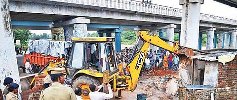 An illegal building being pulled down on Monday  | Sunish P Surendran