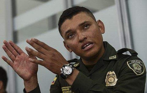 Colombian police second lieutenant Marlon Lengua takes part in an interview with AFP at the Metropolitan Police headquarters in Medellin, Colombia on November 25, 2017.  | AFP