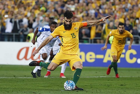 In this Wednesday, Nov. 15, 2017 filer, Australia's Mile Jedinak scores his second goal against Honduras during their World Cup soccer playoff deciding match in Sydney, Australia. | AP