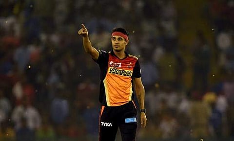 Sunrisers Hyderabad cricketer Siddarth Kaul celebrates the wicket of Kings XI Punjab cricketer Axar Patel during the 2017 Indian Premier League (IPL) Twenty20 cricket match between Kings XI Punjab and Sunrisers Hyderabad at Punjab Cricket Association Cric
