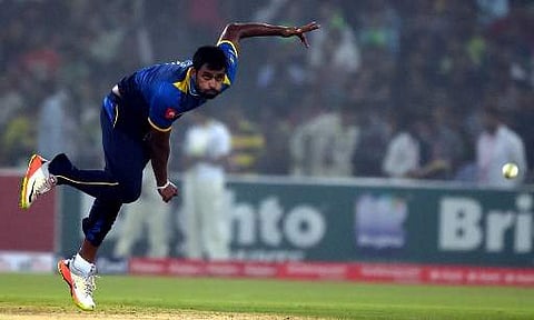 Sri Lankan cricket captain Thisara Perera delivers a ball during the third and final T20 cricket match between Pakistan and Sri Lanka at the Gaddafi Cricket Stadium in Lahore on October 29, 2017. | AFP