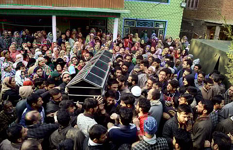 The body of the killed BJP youth leader being carried by family members and friends on Friday. (PTI Photo)