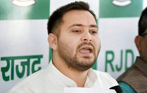 Former Bihar deputy chief minister and RJD leader Tejashwi Yadav addresses a press conference in Patna on Friday. | PTI