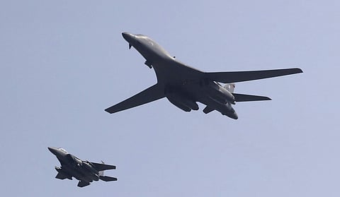In this Sept. 13, 2016, file photo, a U.S. B-1B bomber, right, flies over Osan Air Base with a U.S. fighter jet in Pyeongtaek, South Korea. (Photo | Associated Press)