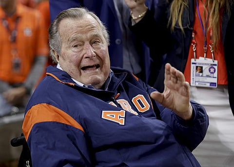 Former President George H.W. Bush waits on the field for first pitch ceremony before Game 5 of baseball's World Series against the Los Angeles Dodgers Sunday, Oct. 29, 2017, in Houston. | AP