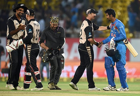 New Zealand player Colin Munro greets Jaspreet Bumrah after winning the second T20 match in Rajkot on Saturday. India started the 197-run-chase in disastrous fashion by losing in-form openers, Dhawan and Rohit Sharma, in the second over to Boult. | PTI
