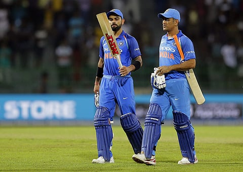 India's captain Virat Kohli (L) and MS Dhoni leave the ground.(AP)