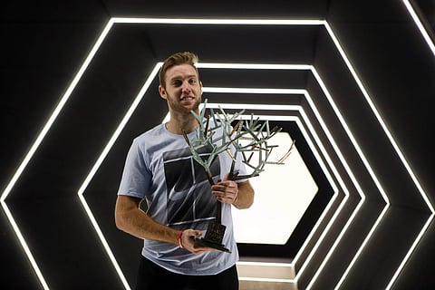 Jack Sock of the United States poses with his trophy after his victory against Filip Krajinovic of Serbia during their final match of the Paris Masters tennis tournament at the Bercy Arena in Paris, France, Sunday, Nov. 5, 2017. | AP