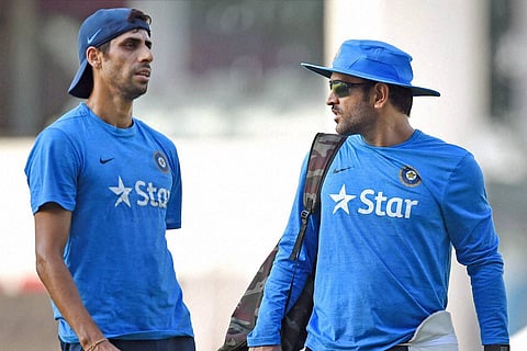 M S Dhoni with Ashish Nehra . | PTI