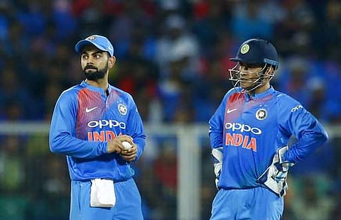 India's captain Virat Kohli, left, and teammate Mahendra Singh Dhoni during their third T20 against New Zealand in Thiruvananthapuram.| AP