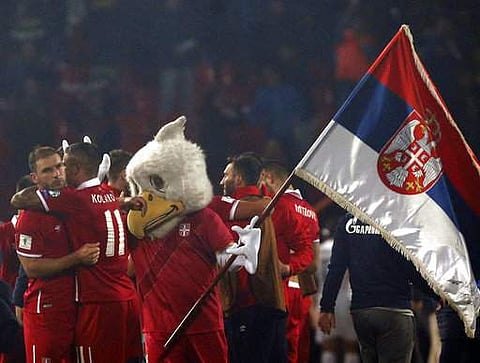 Serbian players celebrate at the end of the World Cup Group D qualifying soccer match between Serbia and Georgia at the Rajko Mitic stadium in Belgrade, Serbia, Monday, Oct. 9, 2017. | AP
