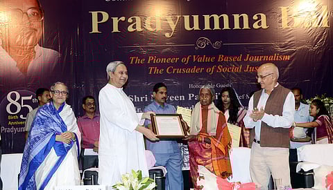 Chief Minister Naveen Patnaik presenting Pradyumna Bal Memorial Award to social activist Kamala Pujari at KIIT auditorium in Bhubaneswar on Wednesday | Express
