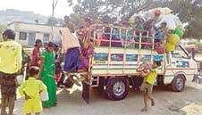 Villagers, mostly farm hands, from Kosigi get into a four-wheeler to migrate to Bengaluru | Express