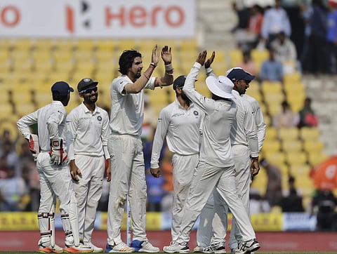 India's Ishant Sharma, third left, celebrates with teammates the dismissal of Sri Lanka's Dimuth Karunaratne during the first day of their second test cricket match in Nagpur, India, Friday, Nov. 24, 2017. | AP
