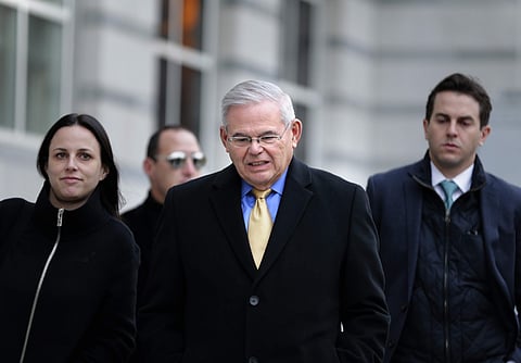 New Jersey Senator Bob Menendez, center, leaves the federal courthouse in Newark, N.J., Tuesday, Nov. 14, 2017. | AP