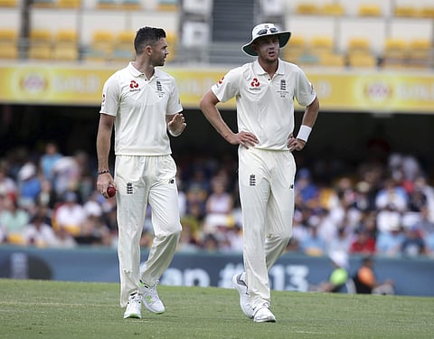 England's James Anderson, left, and Stuart Broad talk each other during their Ashes cricket test against Australia in Brisbane, Australia, Monday, Nov. 27, 2017. | AP