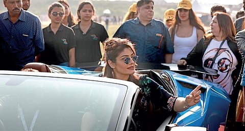 Bollywood actress Raveena Tandon takes a ride at the India Speed Week at Jakkur Aerodrome in Bengaluru on Saturday;