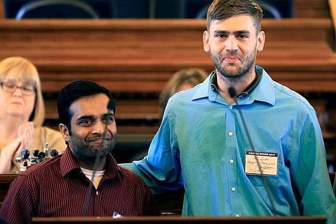 Alok Madasani, left, and Ian Grillot, right, survivors of the February Kansas shooting at Austins Bar and Grill, were recognized in Topeka by the state’s House speaker, Ron Ryckman Jr. (Associated Press)