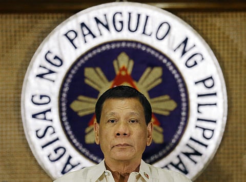 In this July 18, 2017 file photo, Philippine President Rodrigo Duterte stands in front of the presidential seal during a ceremony with the Armed Forces of the Philippines at the Malacanang presidential palace in Manila. (Photo | Associated Press)