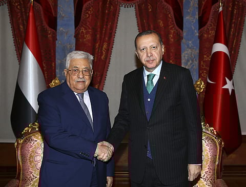 Turkey's President Recep Tayyip Erdogan, right, shakes hands with Palestinian President Mahmoud Abbas, left, prior to their meeting in Istanbul, Tuesday, Dec. 12, 2017. (Photo | Associated Press)