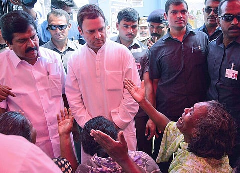 Rahul Gandhi consoling  family members of scores of dead and missing fishermen after Cyclone Okhi hit the Poonthura coast in Thiruvananthapuram and many places in Kerala and southern Tamilnadu. Local MLA V S Shivakumar is also seen. (Express Photo | BP De