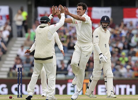Australia's Mitchell Starc, second right, celebrates bowling out England's James Vince, right, during the fourth day of their Ashes cricket test match in Perth. (AP)
