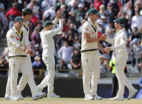 Australian players, from left to right, David Warner, Mitchell Starc, Nathan Lyon, Josh Hazlewood and Steve Smith celebrate winning their Ashes cricket test match against England in Perth. | AP