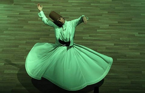 Far from being only an act of introvert worship, the dance of the whirling dervishes is now a huge spectacle in Turkey, attracting flocks of tourists every year. (AFP)
