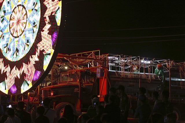 The lights are controlled by individual switches that are turned on and off following the beat of the music.  In pic: A group of lantern makers turn several steel cylinders by hand to manipulate the thousands of light bulbs in a single giant lantern.(Photo| AP)