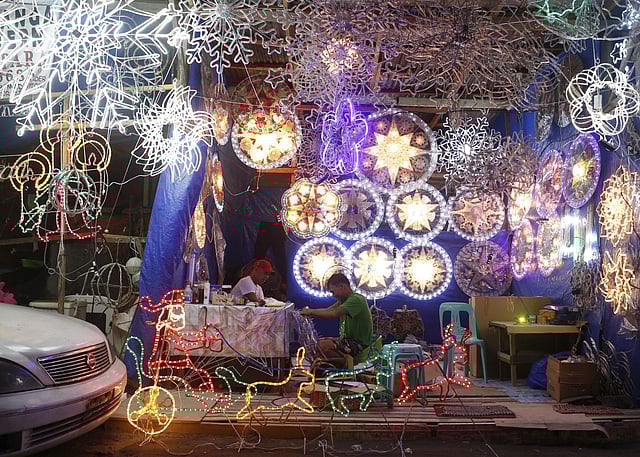 Lantern makers work on traditional Christmas lanterns locally known as 'parols' in a side street shop in Manila, Philippines. These small lanterns traditionally decorate many Filipino homes during the Christmas holidays. (Photo | AP)