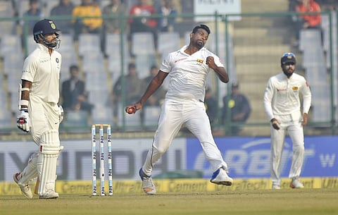 Sri Lankan cricketer Lahiru Gamage in action during the third cricket test match against India .| PTI