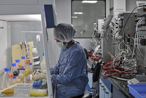An employee of Biocon Ltd works inside the company's research and development centre in Bengaluru, India. (File photo | Reuters)