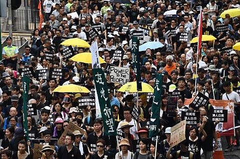 Pro-independence activists in Hong Kong (FileHONG KONG: Hong Kong have been fined $3,000 after fans jeered the Chinese national anthem during an Asia Cup match last month, the third time they have been punished for booing.   Fans have taken to booing the 