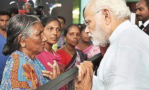 Prime Minister Narendra Modi listens to fishermen community members at Poonthura in Thiruvananthapuram | PIB PHOTO