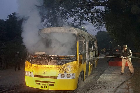 The bus that was torched by a group of students who were protesting against the arrest of a student leader affiliated to the Samajwadi Party at Banaras Hindu University in Varanasi on Wednesday. (PTI Photo)