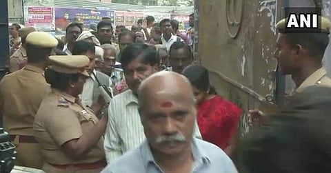 People queue up at a polling booth set up at Chennai Girls Higher Secondary School in Tiruvottiyur. (Photo: ANI/Twitter)