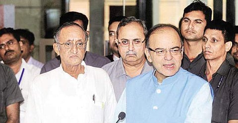 A file image of Amit Mitra (left) and Finance Minister Arun Jaitley