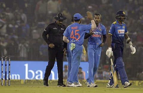 ndia's Hardik Pandya, second right, celebrates with teammates the dismissal of Sri Lanka's Akila Dananjaya during their first Twenty20 international cricket match in Cuttack, India, Wednesday, Dec. 20, 2017. | AP