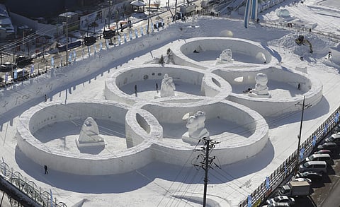 Snow sculpture in the shape of the Olympic rings displaying at the Daegwanryung Snow festival in Pyeongchang | AP