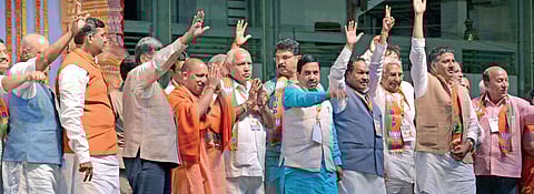 BJP leaders participate at the Parivarthana Yatra at Nehru Stadium in Hubballi on Thursday. Uttar Pradesh Chief Minister Yogi Adityanath, BJP state president B S Yeddyurappa, party leaders Prahlad Joshi, K S Eshwarappa and others look on | D HEMANTH