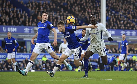 Everton's Jonjoe Kenny, centre and Chelsea's Tiemoue Bakayoko battle for the ball, during the English Premier League soccer match between Everton and Chelsea, at Goodison Park, in Liverpool, England, Saturday Dec. 23, 2017. | AP