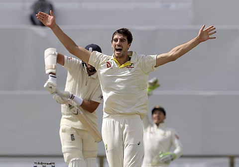 Australia's Pat Cummins celebrates the dismissal of England's Stuart Broad during the final day of their Ashes Test match in Perth, Australia, Monday, Dec. 18, 2017. | AP