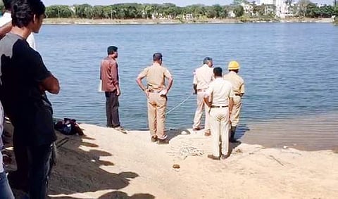 Fire and emergency personnel looking out for bodies of two school students at a lake at Kothanur Dinne on Friday