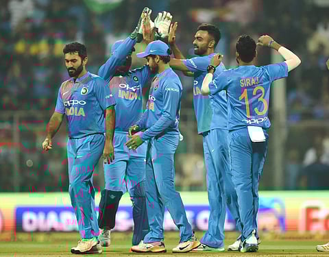 Indian pacer Jaydev Unadkat celebrates with his teammates the wicket of Sri Lanka's Kusal Perera during the third T20 at Wankhede Stadium in Mumbai on Sunday. | PTI