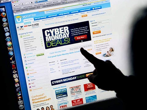 A consumer looks at Cyber Monday sales on her computer in November 2010 at her home in Palo Alto, Calif. Retailers are rolling out online deals. (Photo | Associated Press)
