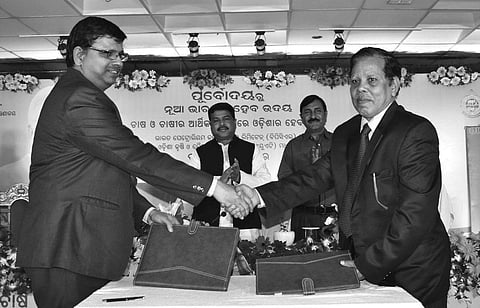OUAT and BPCL officials exchanging MoA for research on bio-fuel, in Bhubaneswar on Sunday | Express