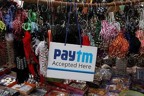 An advertisement of Paytm, a digital wallet company, is pictured at a road side stall in Kolkata. (Photo | Reuters)