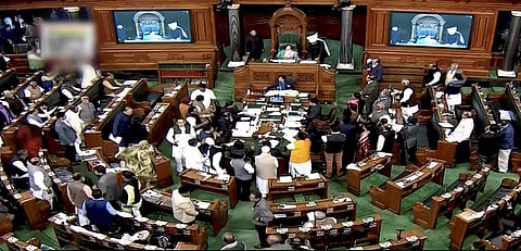 Opposition members protested in the Lok Sabha in New Delhi. (PTI)